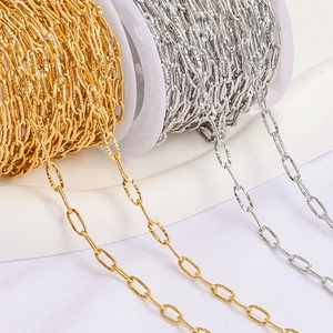 Detail of gold and silver stainless steel oval link jewelry chains on reels for DIY projects