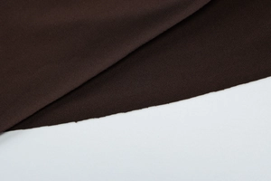 Detailed macro view of dark brown knit fabric texture on this slim backless dress