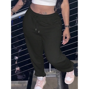 Detailed view of dark grey cotton sweatpants featuring drawstring waist and elastic cuffs