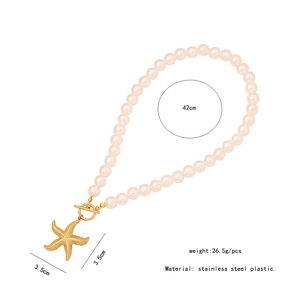 Detail view of pearl necklace with gold starfish pendant and OT buckle measurements