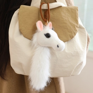 Plush white horse charm with fluffy long tail and brown braided rope for bags