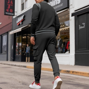 Men's urban black flight baseball jacket and cargo pants tracksuit set in street scene