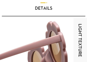 Detail view of pink flower-shaped frame and hinge design on children's sunglasses