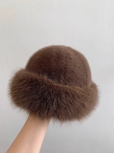 Detailed view of plush brown faux fur winter bucket hat with thick warm texture