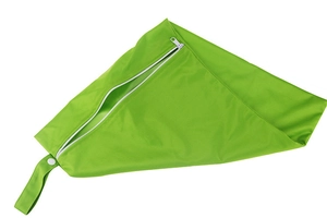 Close-up of grass green waterproof diaper bag with white zipper and snap handle