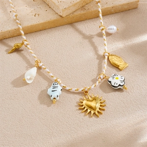 Chic ceramic floral and fish pendant necklace with braided rope chain and gold accents