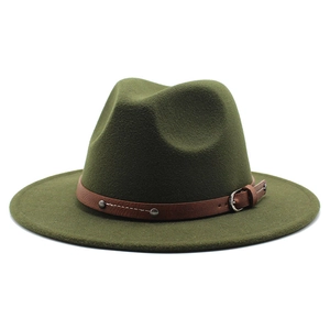 Olive green fedora hat close-up with brown leather band and metal rivets detail