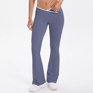 Detail of high-waist yoga pants featuring a crossover waist and white contrast binding