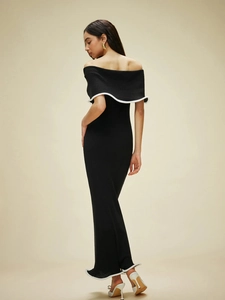 Off-shoulder black knit maxi dress with white wavy trim and slim fit silhouette