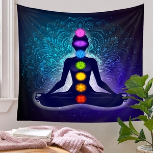 Detail view of seven chakra meditation tapestry hanging in a serene room setting