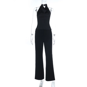 Detail of black two-piece set featuring a halter backless top and wide-leg trousers