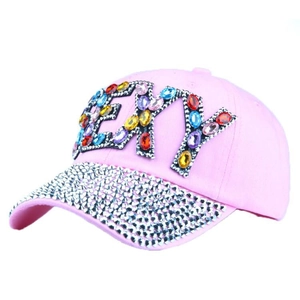 Pink rhinestone baseball cap featuring SEXY crystal lettering and studded brim detailing