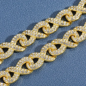 Macro shot of gold-plated infinity link chain with micro-paved rhinestones for men