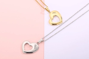 Detailed macro view of heart shaped pendants in gold and silver with crystal accents