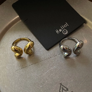 Artistic gold and silver plated butterfly open rings set on a brushed metal tray