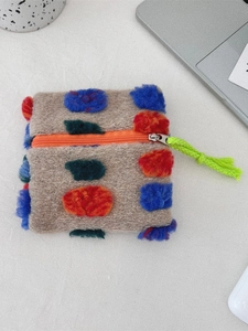 Retro plush pouch with colorful pom-poms and orange zipper for makeup or earphones