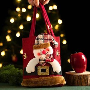 Vintage Christmas snowman gift bag made of red burlap with plush trim and buckle detail