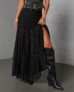 Detailed view of black lace maxi skirt featuring high side slit and intricate texture