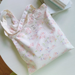 Floral cotton canvas tote bag with pink flower patterns and double handles for daily use
