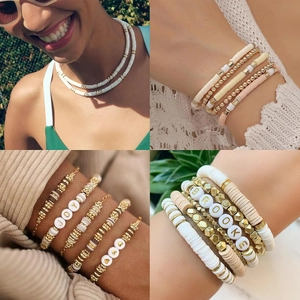 Detail of DIY clay bead bracelets with letters BROOKE and JOY and golden spacers
