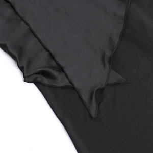 Detailed close-up of overlapping black satin fabric edges and stitching of the evening dress