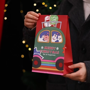 Red and green Christmas gift bags with cartoon animals and festive holiday patterns