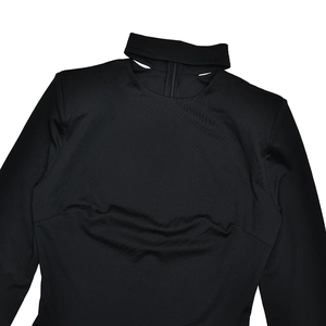 Detail of black long sleeve jumpsuit featuring a choker neck and cutout design