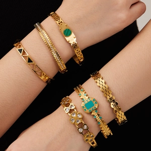 Set of 6 gold stainless steel bracelets with zircon and enamel details on a model