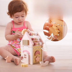 Detailed close-up of 5-in-1 educational wooden toy house with shape sorter and gear blocks