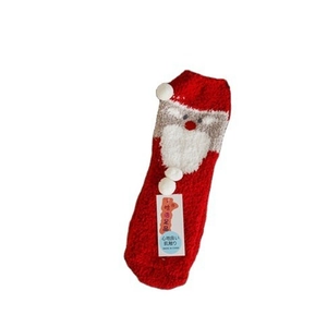 Thick red coral fleece Christmas socks featuring Santa Claus design and soft pom-poms