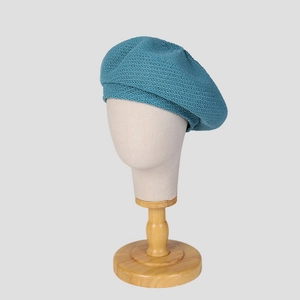 Teal blue knitted beret for women thin summer painter hat shown on mannequin
