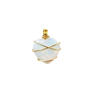 Detailed close-up of opalite heart pendant wrapped in gold wire on white background