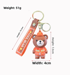 Detailed view of firefighter bear keychain with dimensions 7.3x4cm and orange silicone strap
