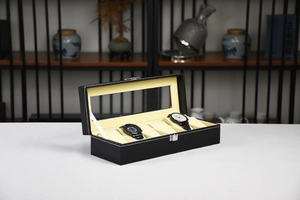 Detail view of 6-slot black PU leather watch box with glass lid and contrast white stitching