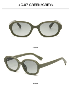 Detail view of oval military green sunglasses with grey lenses in front and 45-degree angle