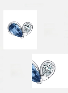 Macro shot of 925 silver stud earring with blue and clear drop-shaped 5A cubic zirconia