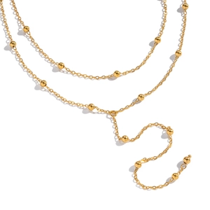 Detail view of double-layered gold beaded Y-chain necklace in stainless steel