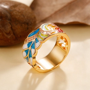 Detailed macro view of gold-plated punk ring with colorful enamel and pavé zircons