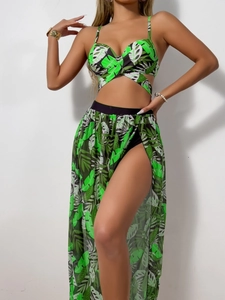 Detail of tropical leaf print bikini set and semi-transparent side slit beach skirt