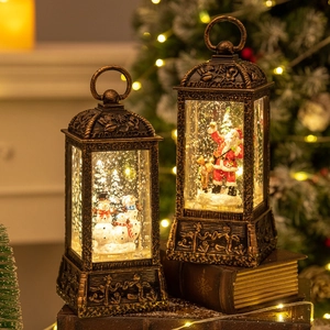 Bronze Christmas lanterns with Santa and Snowman motifs, warm LED lights on books
