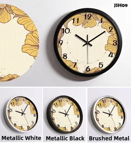 Detail of floral wall clock dials with white, black, and brushed silver metal frames