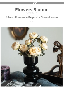 Retro champagne roses in a black ceramic double-sphere vase with vintage art decor