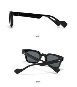 Detail of black square sunglasses featuring golden studs and leopard-shaped temple design