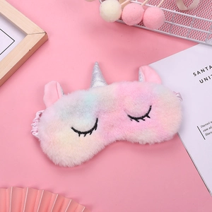 Rainbow plush unicorn sleep mask with gradient pastel fur and silver sequin horn for travel