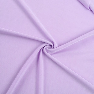 Close-up of purple mesh fabric texture showing detailed weave and draped spiral folds