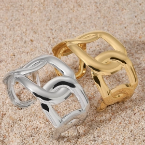 Adjustable hollow C-shaped chain link bangle in gold and silver finish on sand background