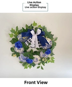 Detailed front view of blue rose wreath with porcelain patterns and ribbon bow