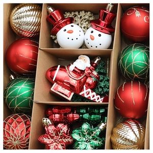 Detailed overhead view of a 70pcs Christmas ornament set in red, green, and gold colors