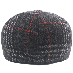 Detail view of the houndstooth wool blend fabric and stitching on the newsboy cap back