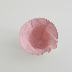 Internal detail of pink cotton sun hat showing breathable fabric and seam construction